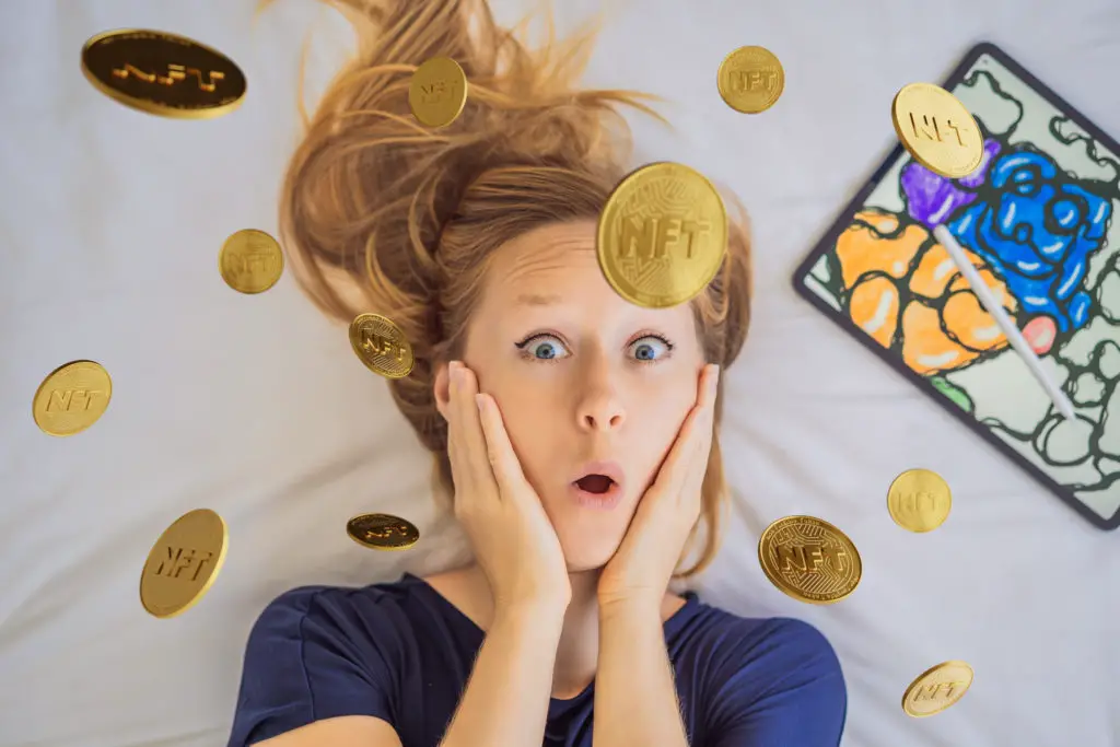 Young female digital artist being showered with cryptocurrency.