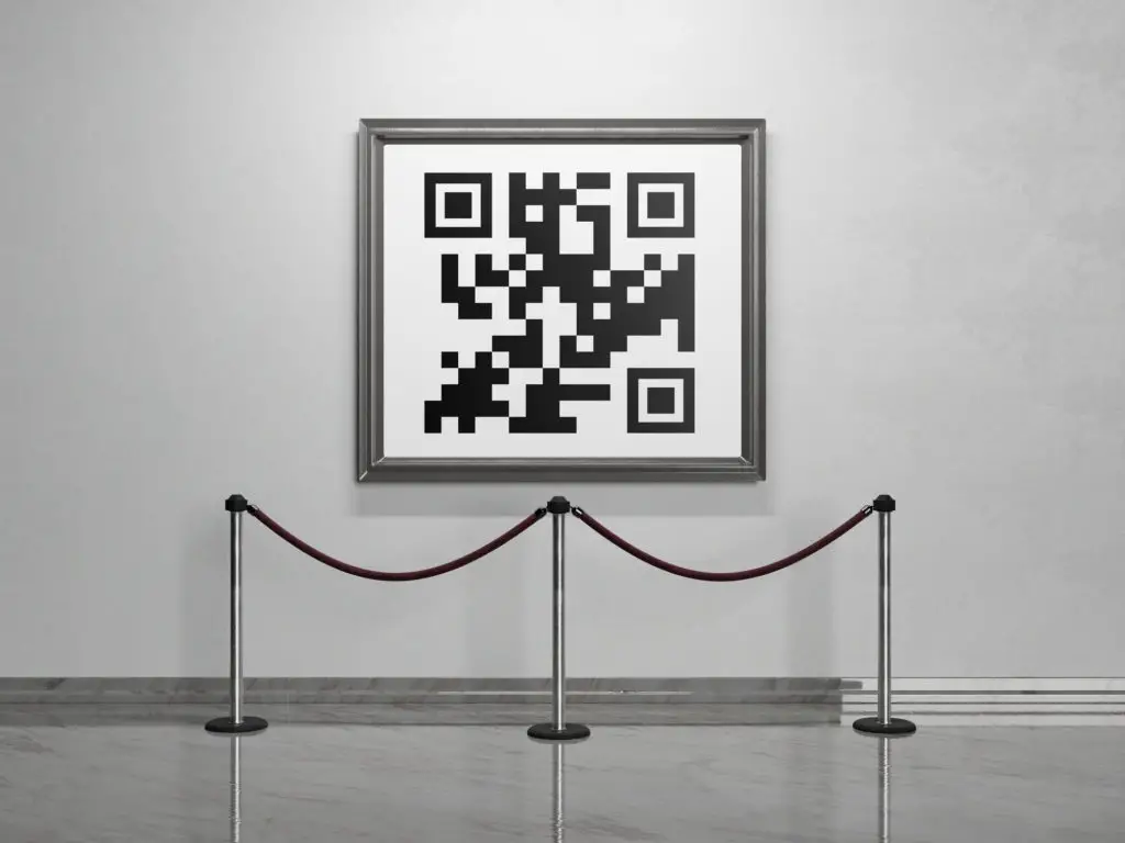 QR code framed an hung in a museum to represent NFT.