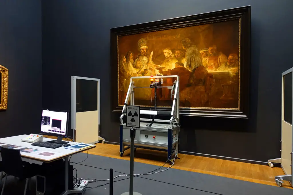 A machine scanning a Rembrandt painting to show artist how to digitize their physical art.